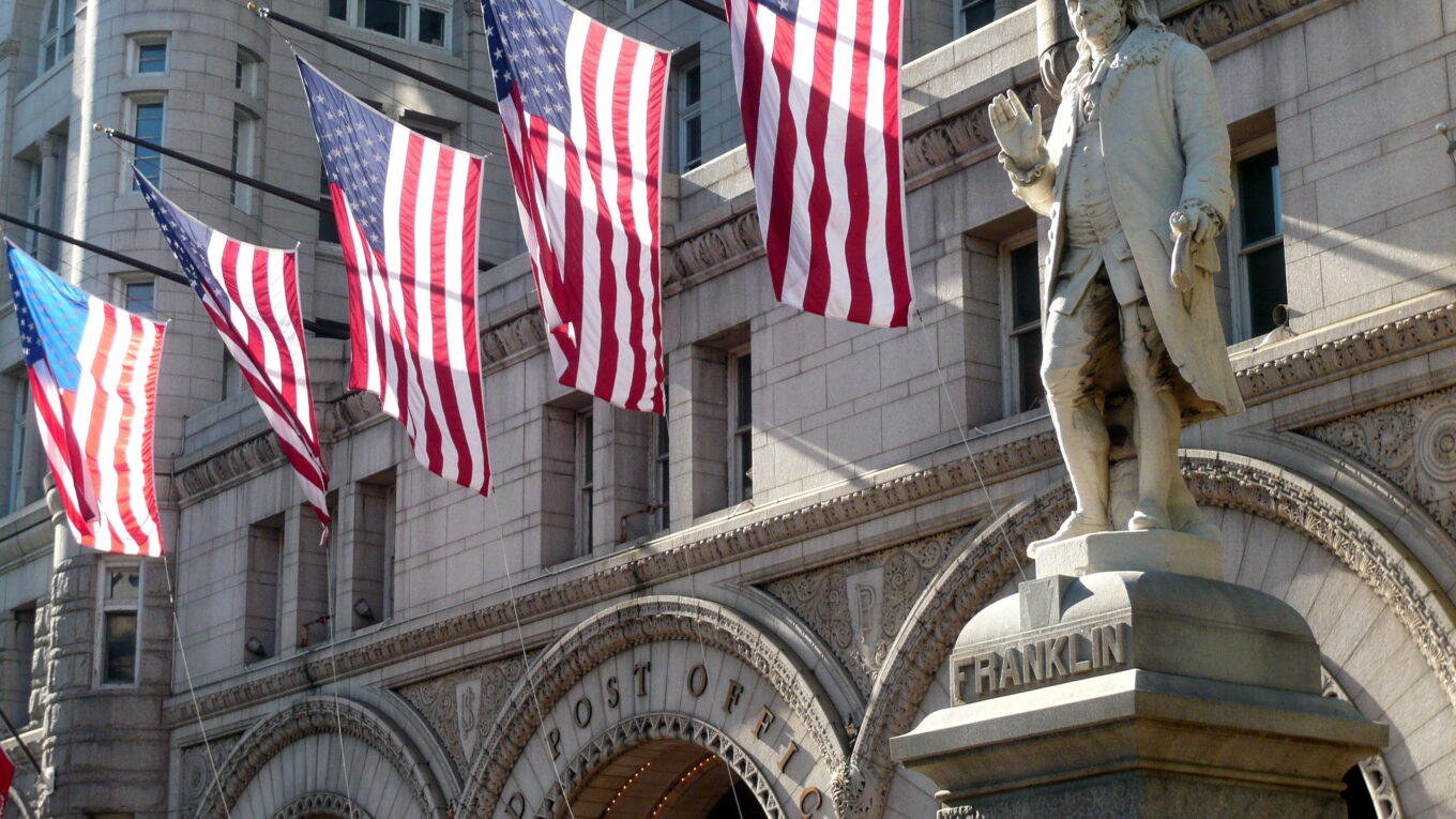 Statue of Benjamin Franklin in front of Washington DC’s Old Post Office building